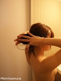 Japanese Mimi Inamura plays with the shower head
