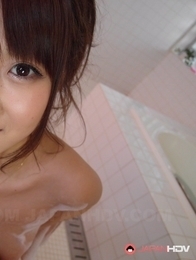 Hitomi Kitagawa washes a dick with soap and her boobs