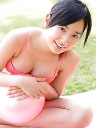 Kaho Takashima in orange swimming suit i playful on beach