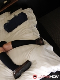 Schoolgirl Ami Ishihara gets naked on her bed